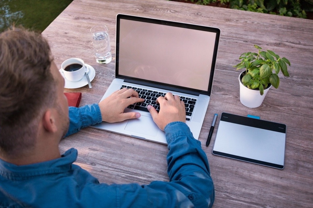 man laptop typing