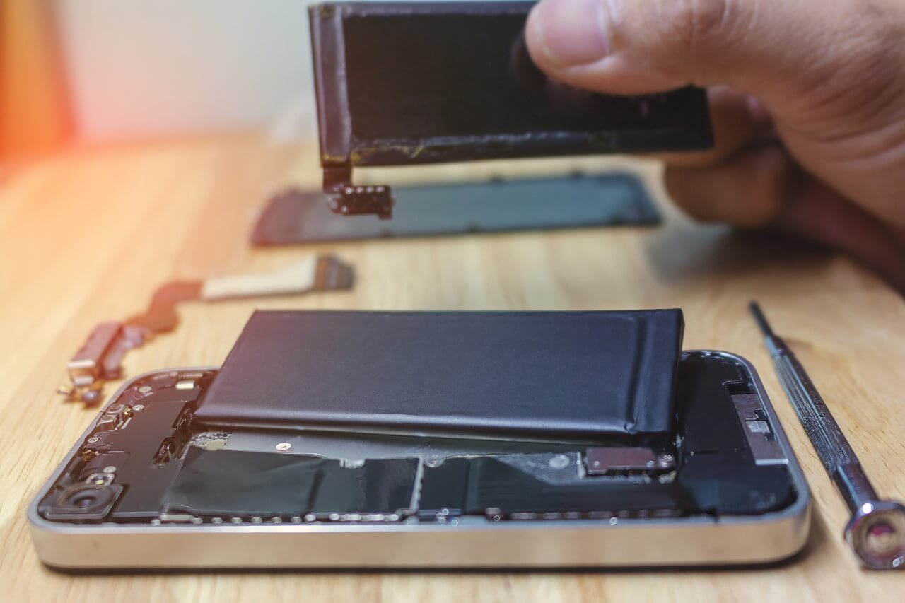 image of an iphone with battery being replaced