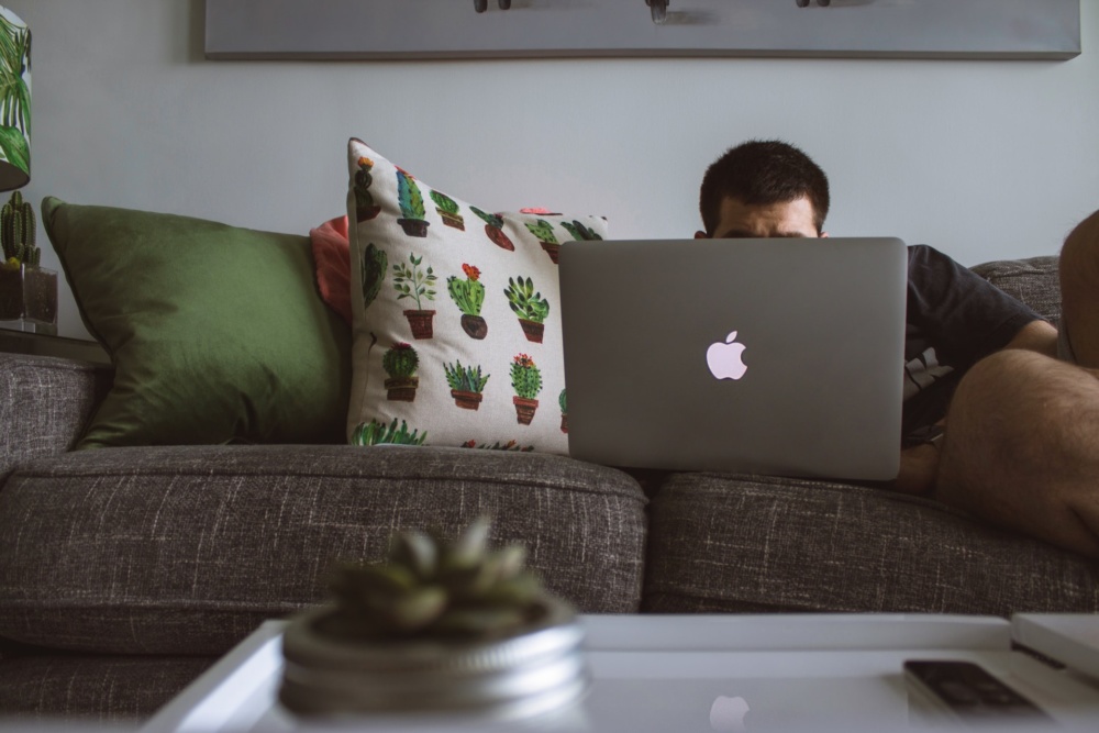 apple mac laptop couch