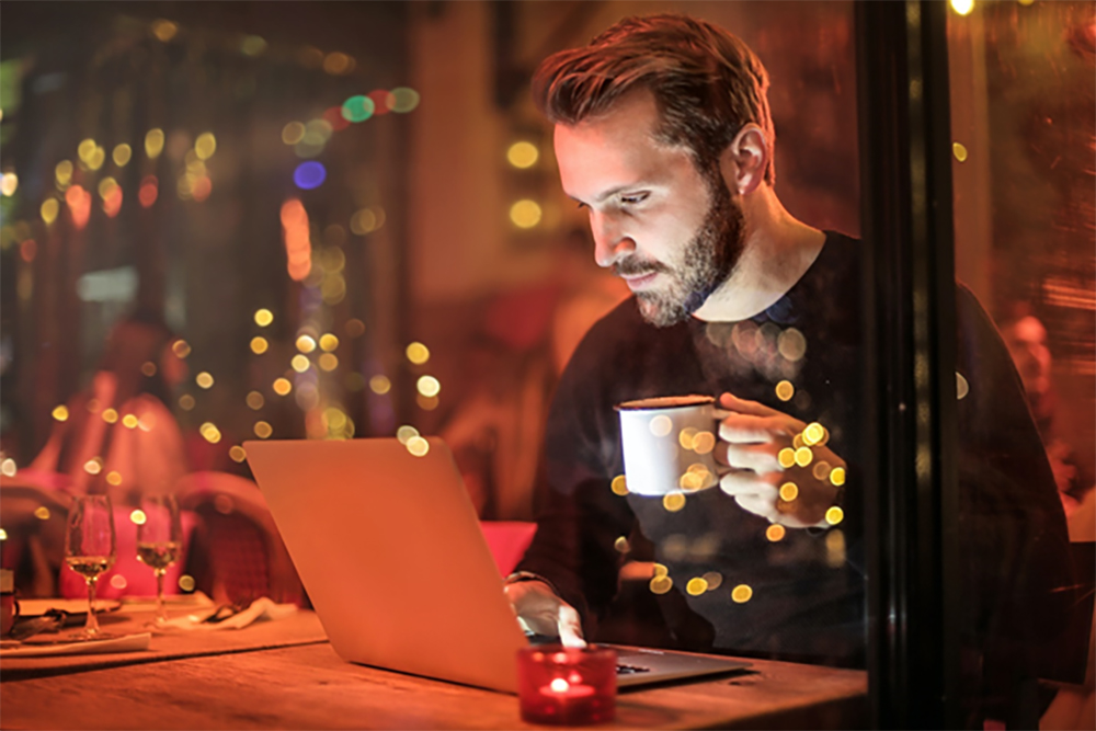 man laptop holidays 2021