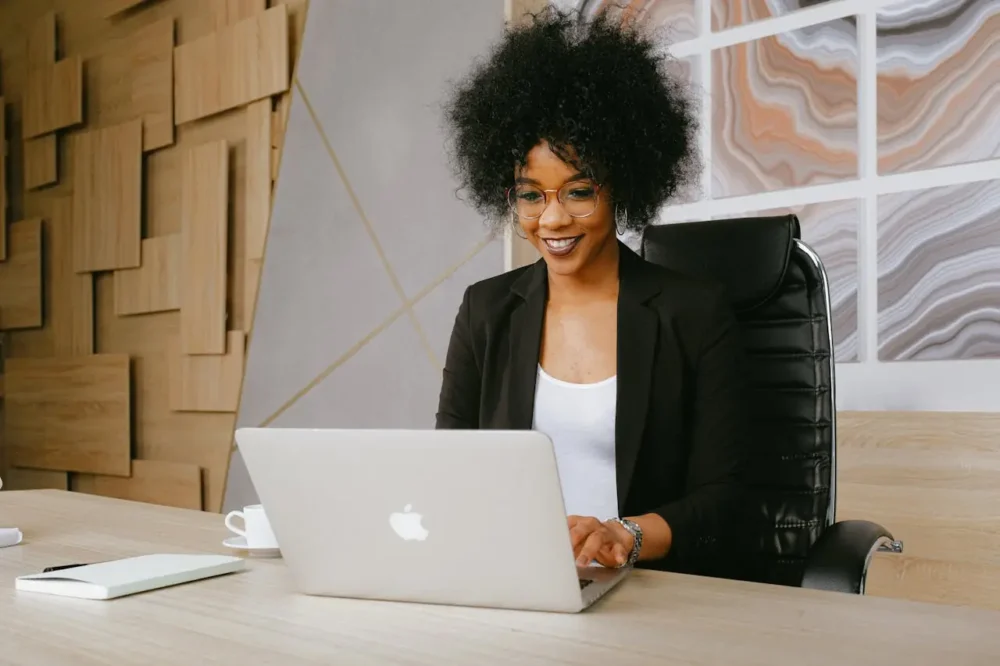 A woman using her laptop in the office